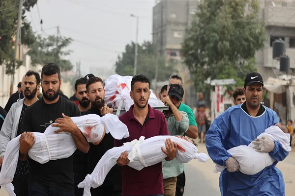 Gaza residents carry bodies of those martyred in Israeli airstrikes