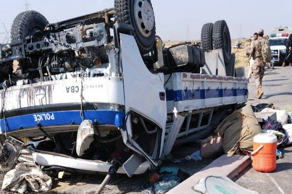 Police truck left upside down on the road after suicide attack in Pakistan