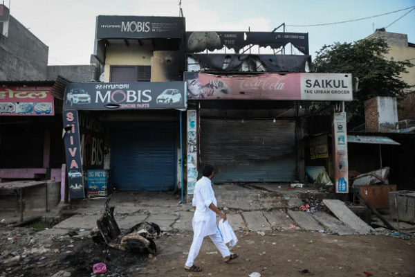 A Hindu mob burned a Muslim shop while leaving a Hindu shop untouched during communal violence in Haryana's Sohna town