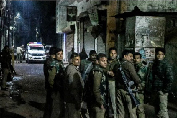 Armed police personnel stand guard following violence near the Shahi Jama Masjid in Sambhal on November 24, 2024.