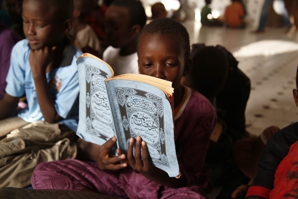 Children reading the Quran