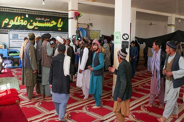 Afghans gather at a mosque where gunmen attacked Shia Muslims in Guzara district of Herat province on April 30, 2024.