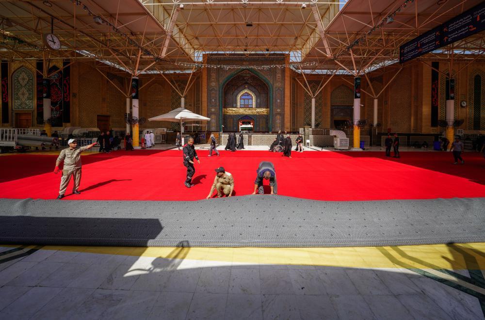 Imam Ali (AS) holy shrine was covered with red carpets ahead of Ashura