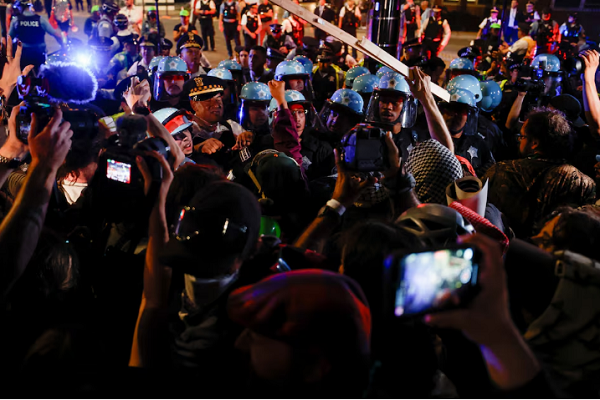 Police officers clash with demonstrators during a protest organized by pro-Palestinian activists, on the sidelines of the Democratic National Convention (DNC), in Chicago, Illinois, US, August 22, 2024.