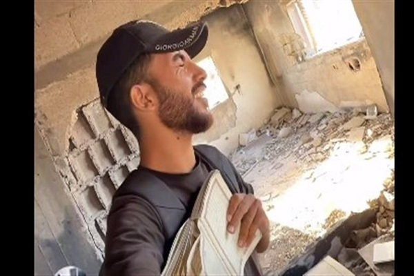 Palestinian Youth Finds Intact Quran Beneath Gaza Rubble
