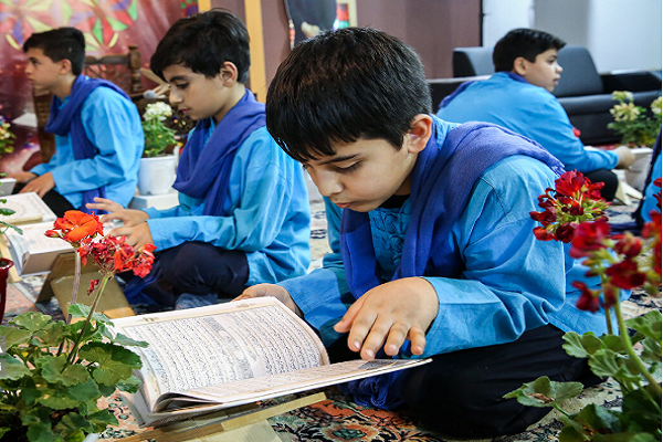 School Students reading the Quran