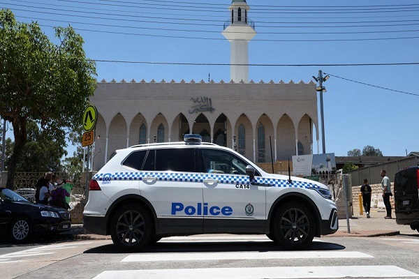 A police care patrols outside Lakemba Imam Ali bin Abi Talib (AS) Mosque in Australia as people arrive for Friday prayers.