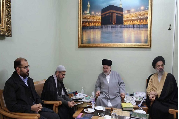 A meeting discussing the organization of the upcoming World Quran Day.