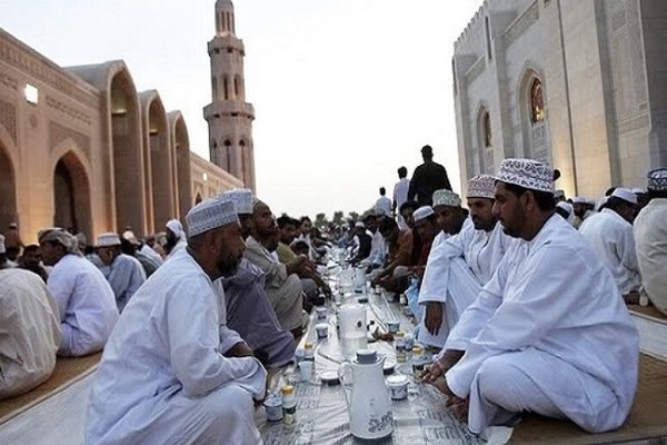 Omani Muslims breaking their fast at Iftar
