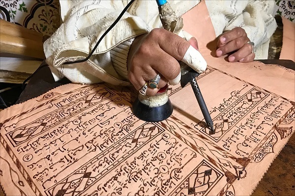 Creativity of Disabled Moroccan Artist in Writing Quran on Goatskin