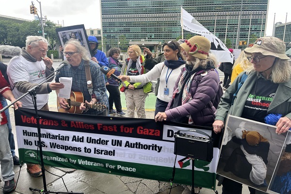 Anthony Donovan on harmonica, left, and Bud Courtney on guitar, a member of St. Joseph Hospitality House, play music during an anti-war demonstration on Thursday, May 22, 2025, outside the United Nations headquarters in Manhattan, New York.