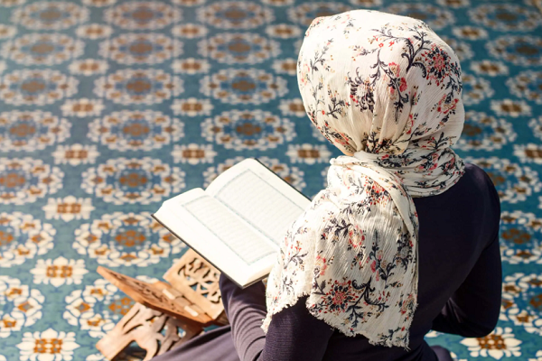 A woman reading the Quran
