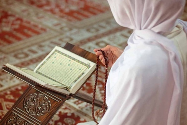 A woman reading the Quran