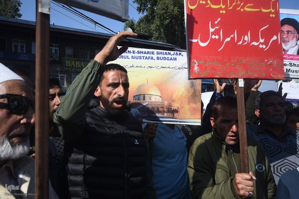 Kashmiri Muslims hold placards as they chant slogans against Israel and the U.S. during a protest against Israel's military operations in Gaza, on October 13, 2023, in Budgam, west of Srinagar, Indian-administered Kashmir, India. (Photo by Mubashir Hassan, IQNA)