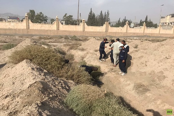 تصاویری از بزرگترین گور جمعی در شهر الرقه سوریه