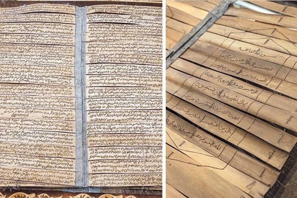 کتابت قرآن روی برگهای نخل خرما کتابت قرآن روی برگهای نخل خرما