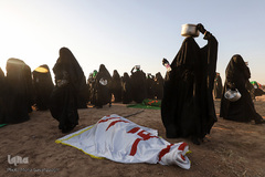 مراسم نمادین خاکسپاری شهدای کربلا در حمیدیه